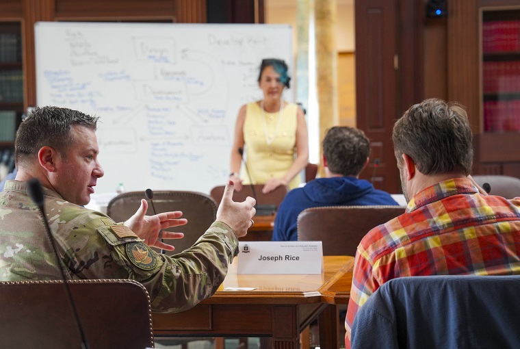 A group of people at a conference 